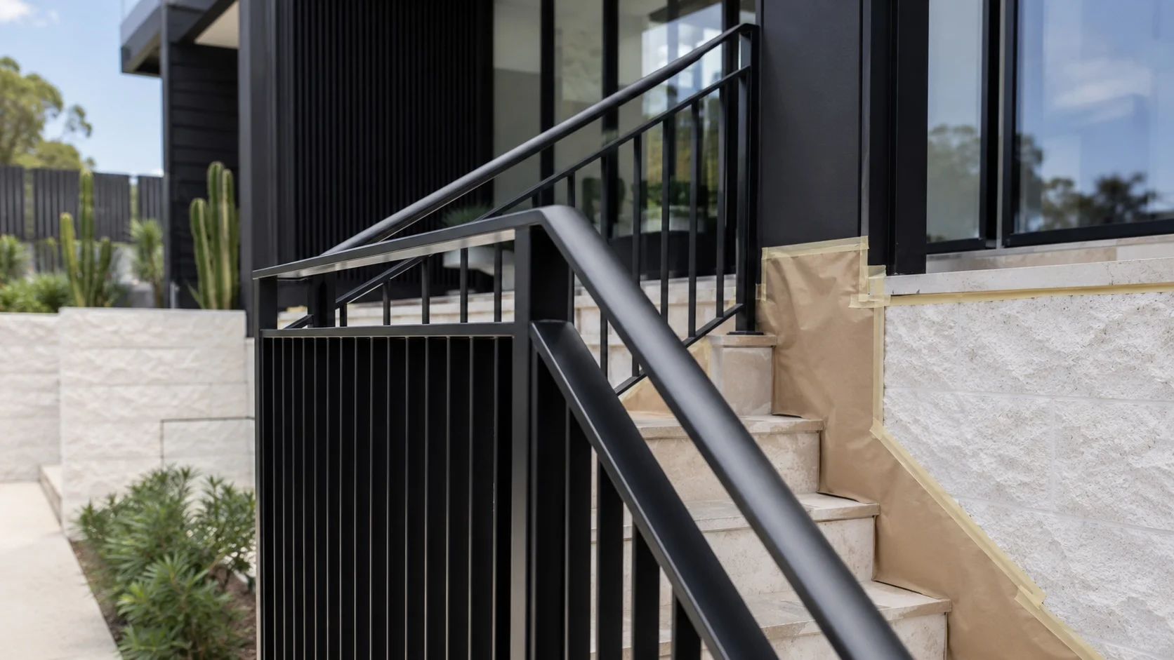 Protective coating system applied to a steel balustrade and handrail on a Sydney home — Limitless Painting